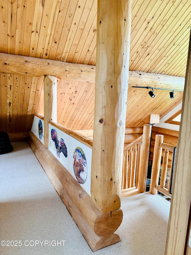 28180 Coastal Vista Cir, Anchor Point, AK 99556 - detailed view of rustic walls, carpet flooring, and a wooden ceiling with exposed beams