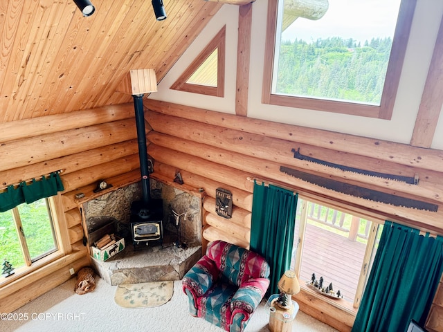 28180 Coastal Vista Cir, Anchor Point, AK 99556 - living area with log walls, a wood stove, and wood ceiling