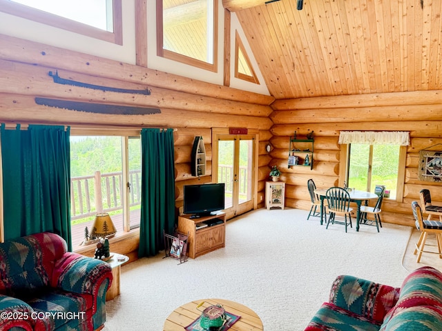 28180 Coastal Vista Cir, Anchor Point, AK 99556 - carpeted living room featuring high vaulted ceiling, log walls, healthy amount of natural light, french doors, and wooden ceiling