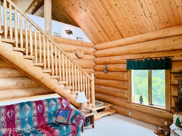 28180 Coastal Vista Cir, Anchor Point, AK 99556 - staircase featuring log walls, wood ceiling, high vaulted ceiling, and carpet