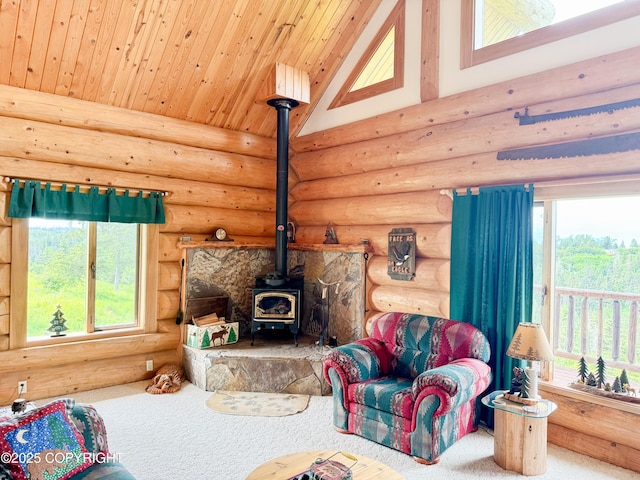 28180 Coastal Vista Cir, Anchor Point, AK 99556 - living area with a wood stove, rustic walls, carpet floors, and high vaulted ceiling
