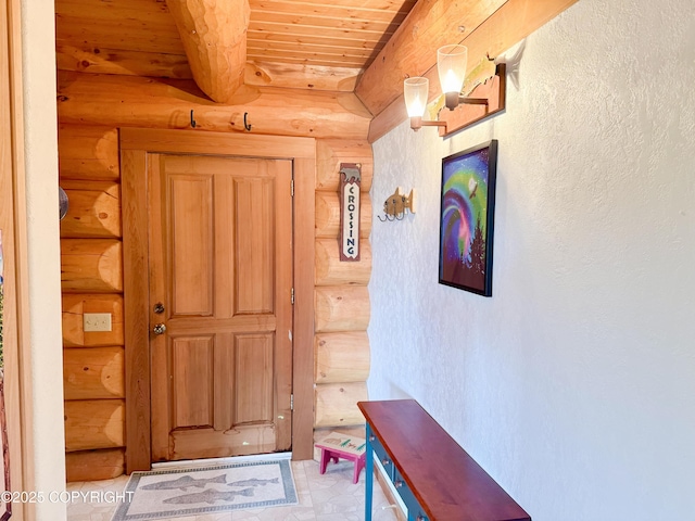 28180 Coastal Vista Cir, Anchor Point, AK 99556 - doorway to outside featuring log walls, a wooden ceiling with exposed beams, a textured wall, and light flooring