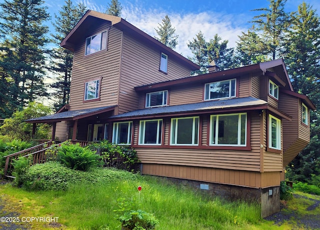 3043 Lakeview Dr, Kodiak, AK 99615 - view of home's exterior with crawl space and a chimney