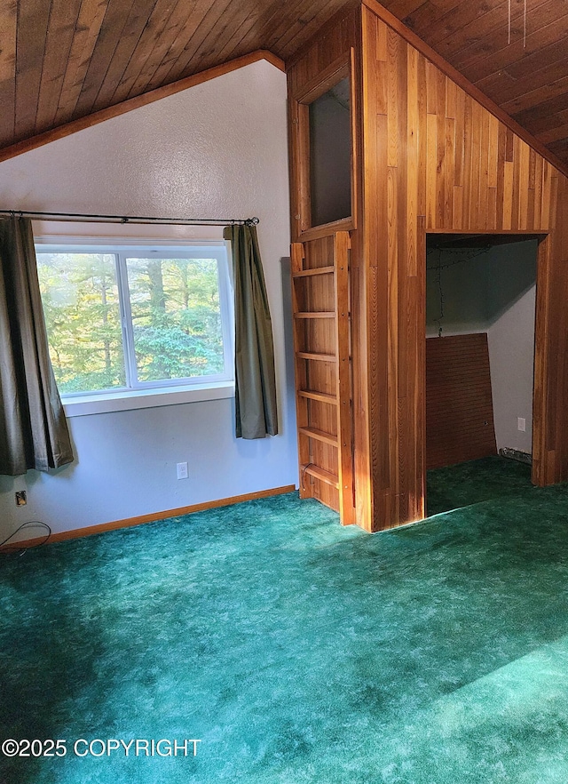 3043 Lakeview Dr, Kodiak, AK 99615 - carpeted empty room with lofted ceiling, wood ceiling, and wood walls