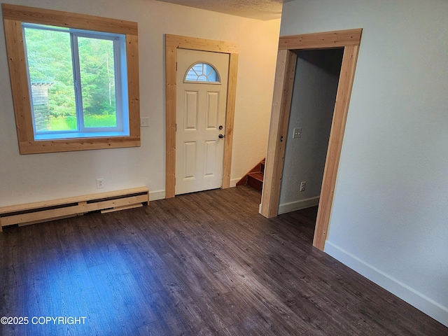 3043 Lakeview Dr, Kodiak, AK 99615 - entryway featuring a baseboard heating unit, plenty of natural light, and dark wood-type flooring