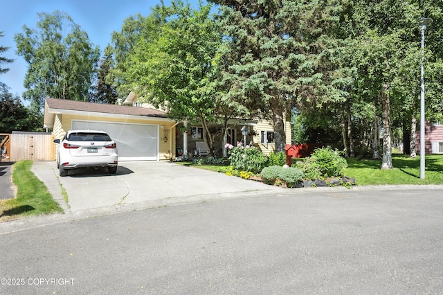 3002 Glacier St, Anchorage, AK 99508 - view of front facade featuring an attached garage, driveway, and a front yard