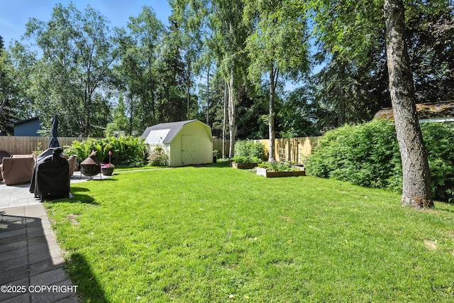 3002 Glacier St, Anchorage, AK 99508 - fenced backyard featuring a storage shed, a patio, and a garden