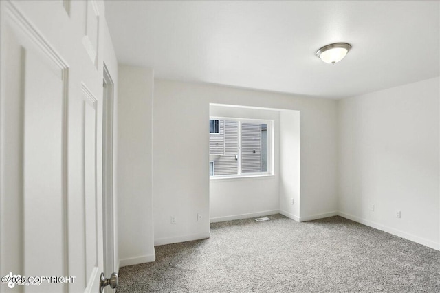 165 Rusty Allen Pl # 64, Anchorage, AK 99504 - carpeted empty room featuring baseboards