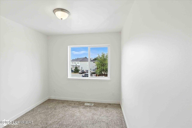 165 Rusty Allen Pl # 64, Anchorage, AK 99504 - carpeted empty room with baseboards