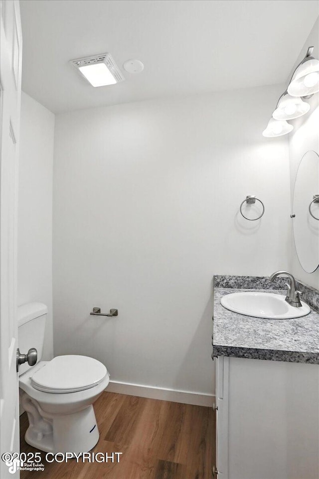 165 Rusty Allen Pl # 64, Anchorage, AK 99504 - half bathroom with vanity and wood finished floors