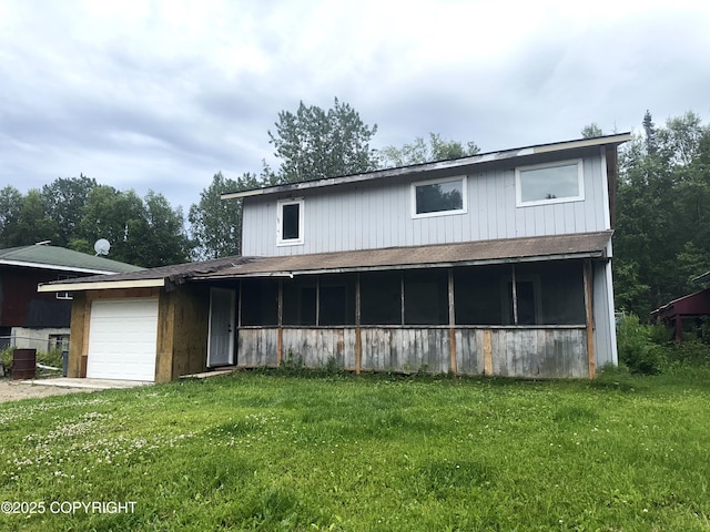 52193 Marlene Ave, Nikiski/North Kenai, AK 99611 - rear view of house with a garage and a lawn