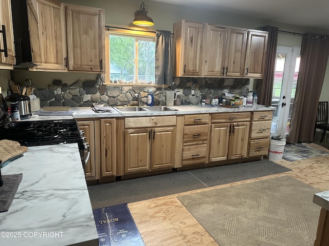 52193 Marlene Ave, Nikiski/North Kenai, AK 99611 - kitchen with plenty of natural light, light countertops, and decorative backsplash