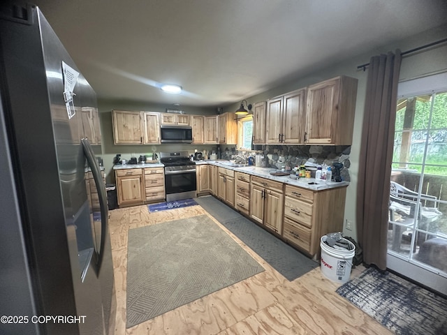 52193 Marlene Ave, Nikiski/North Kenai, AK 99611 - kitchen featuring stainless steel appliances, light countertops, backsplash, and light brown cabinetry