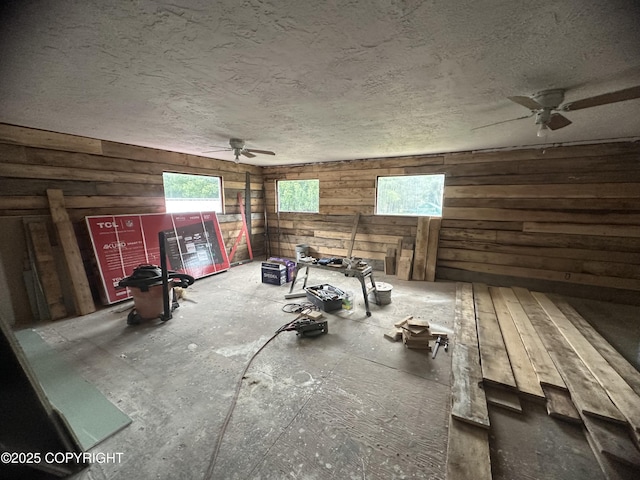 52193 Marlene Ave, Nikiski/North Kenai, AK 99611 - unfurnished room with a ceiling fan, wood walls, and a textured ceiling