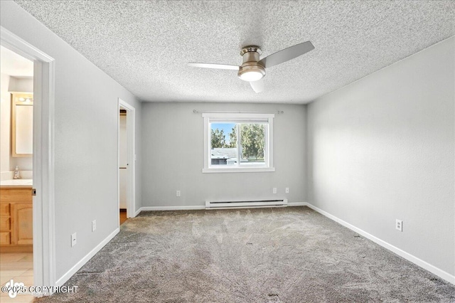 3298 Montpelier Ct Unit 12F, Anchorage, AK 99503 - unfurnished bedroom with a baseboard heating unit, a textured ceiling, carpet, ensuite bathroom, and a ceiling fan