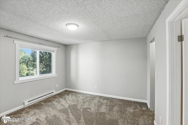 3298 Montpelier Ct Unit 12F, Anchorage, AK 99503 - carpeted empty room with baseboard heating and a textured ceiling