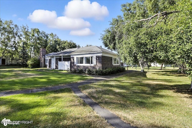 3298 Montpelier Ct Unit 12F, Anchorage, AK 99503 - view of front of home with a front lawn and a chimney