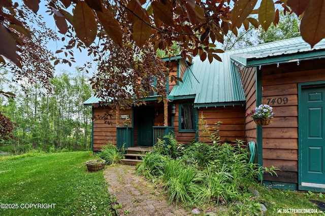 7409 S Timberview Dr, Wasilla, AK 99623 - view of front facade with a front lawn and a metal roof