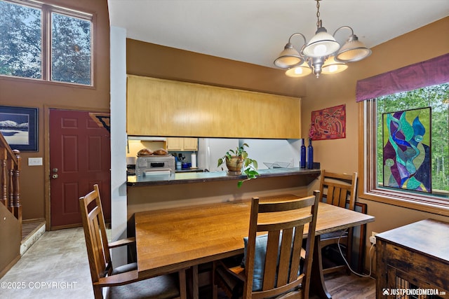 7409 S Timberview Dr, Wasilla, AK 99623 - dining area with a chandelier, plenty of natural light, and stairs