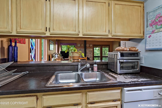 7409 S Timberview Dr, Wasilla, AK 99623 - kitchen with white dishwasher, light brown cabinets, and dark countertops