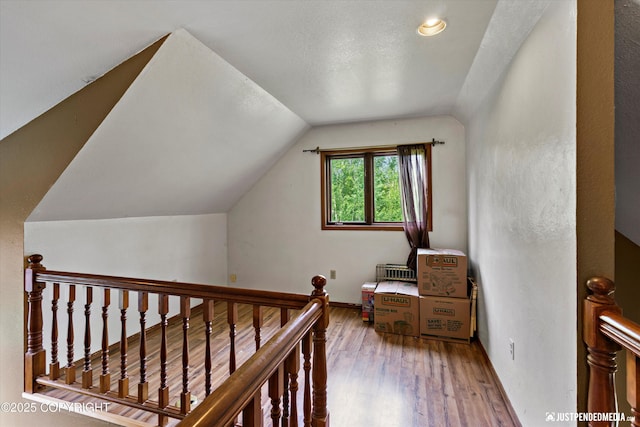 7409 S Timberview Dr, Wasilla, AK 99623 - additional living space featuring lofted ceiling and wood finished floors
