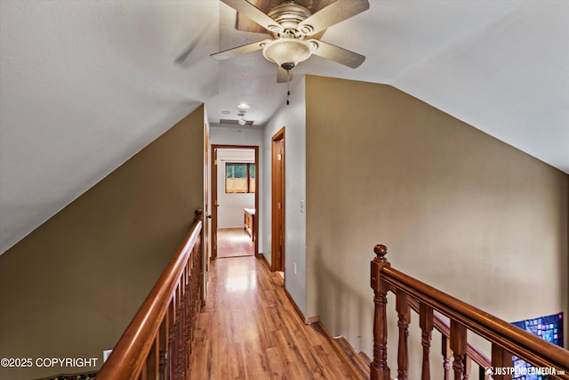 7409 S Timberview Dr, Wasilla, AK 99623 - corridor with an upstairs landing, vaulted ceiling, and light wood-type flooring