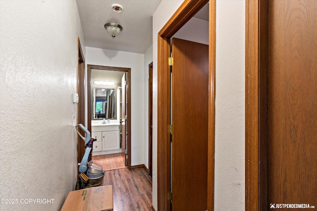 7409 S Timberview Dr, Wasilla, AK 99623 - hall featuring wood finished floors and a textured wall