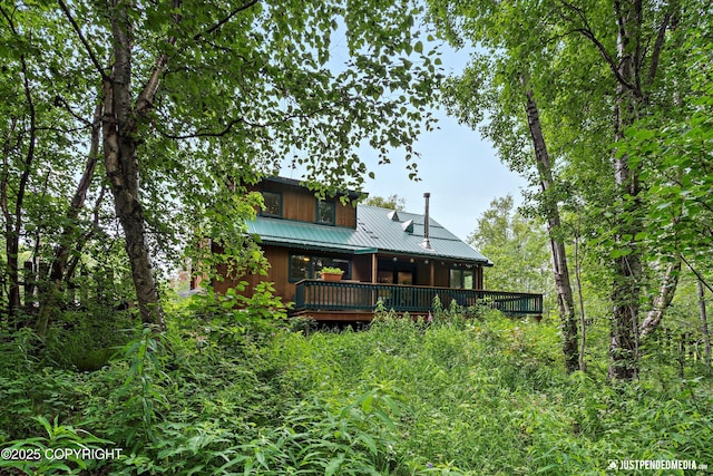7409 S Timberview Dr, Wasilla, AK 99623 - back of house featuring a metal roof and a deck