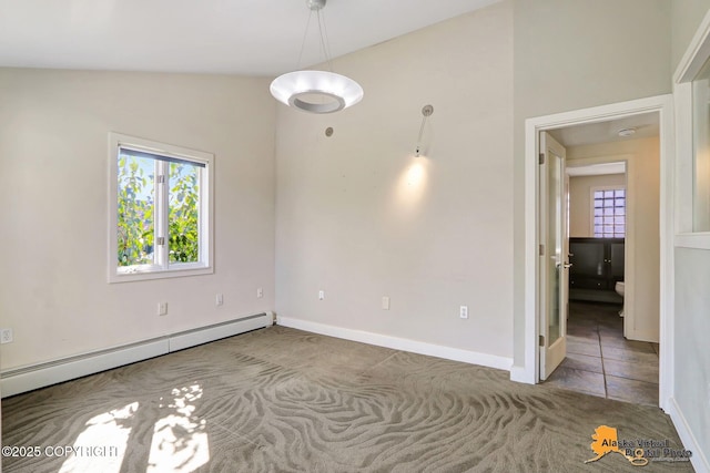 124 E 7th Ave, Anchorage, AK 99501 - spare room featuring a baseboard heating unit, plenty of natural light, and carpet floors