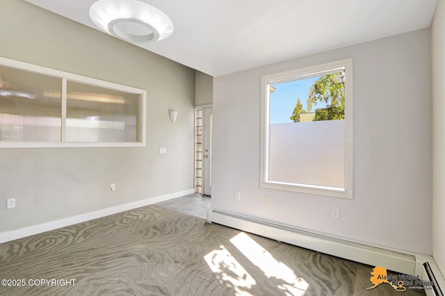 124 E 7th Ave, Anchorage, AK 99501 - empty room with baseboard heating and a baseboard radiator