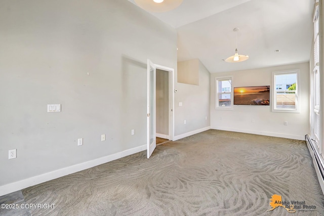 124 E 7th Ave, Anchorage, AK 99501 - unfurnished room featuring carpet flooring, lofted ceiling, and baseboard heating