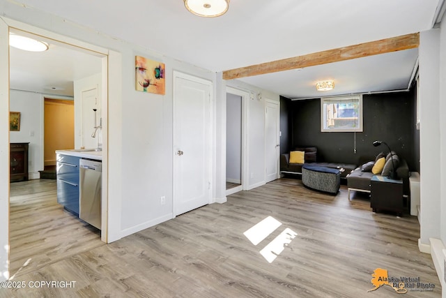 124 E 7th Ave, Anchorage, AK 99501 - living area with light wood-type flooring and beam ceiling