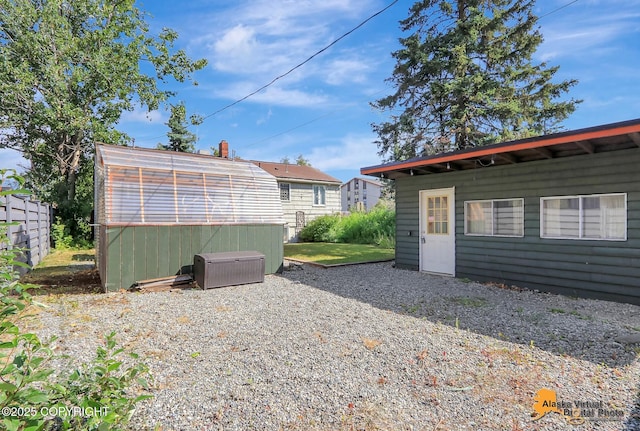 124 E 7th Ave, Anchorage, AK 99501 - rear view of house featuring an outdoor structure