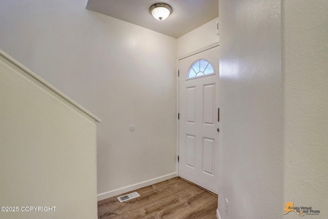 6314 Whispering Loop # 30A, Anchorage, AK 99504 - foyer entrance featuring light wood finished floors and baseboards