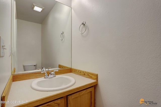 6314 Whispering Loop # 30A, Anchorage, AK 99504 - bathroom featuring vanity and toilet