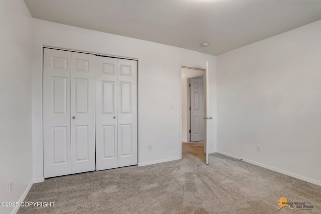 6314 Whispering Loop # 30A, Anchorage, AK 99504 - unfurnished bedroom with carpet floors and a closet