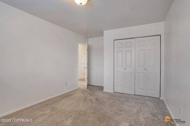 6314 Whispering Loop # 30A, Anchorage, AK 99504 - unfurnished bedroom featuring carpet and a closet