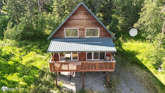 34494 Grizzly Ln, Sterling, AK 99672 - rear view of house with a wooded view, a metal roof, and a wooden deck
