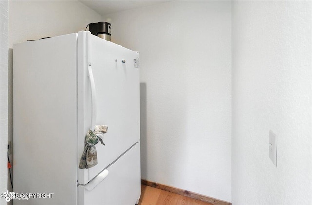 34494 Grizzly Ln, Sterling, AK 99672 - kitchen with freestanding refrigerator and light wood-style flooring