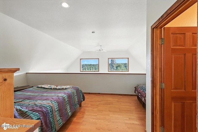 34494 Grizzly Ln, Sterling, AK 99672 - bedroom featuring light wood-style flooring and vaulted ceiling