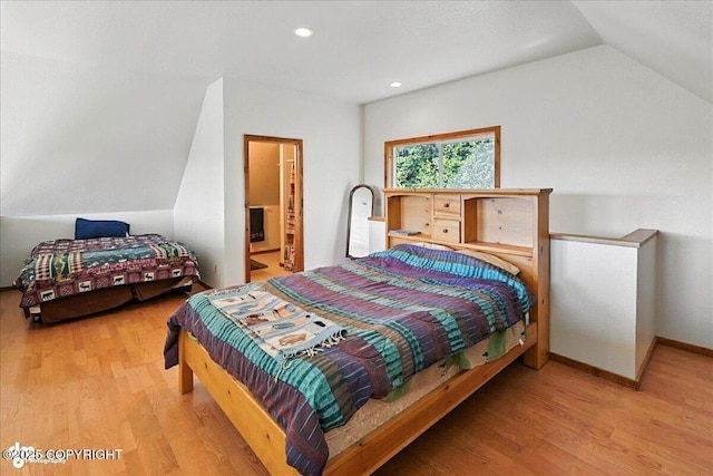 34494 Grizzly Ln, Sterling, AK 99672 - bedroom with wood finished floors, vaulted ceiling, recessed lighting, and ensuite bath