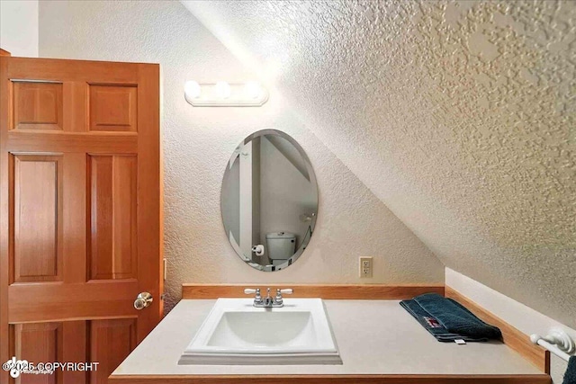 34494 Grizzly Ln, Sterling, AK 99672 - bathroom featuring a textured wall and vanity