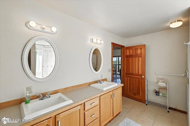34494 Grizzly Ln, Sterling, AK 99672 - bathroom featuring double vanity and tile patterned flooring