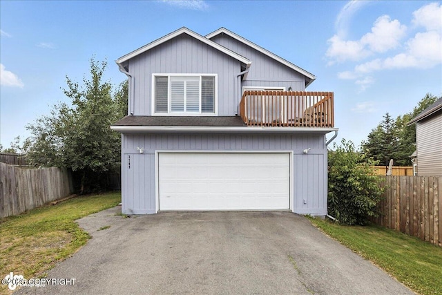 3709 Encore Cir, Anchorage, AK 99507 - view of front facade featuring a balcony, an attached garage, and asphalt driveway
