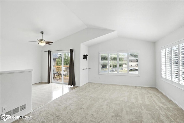 3709 Encore Cir, Anchorage, AK 99507 - carpeted empty room featuring vaulted ceiling and ceiling fan