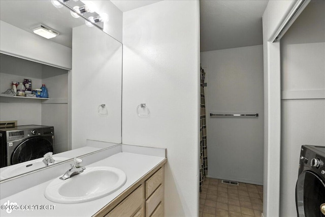 3709 Encore Cir, Anchorage, AK 99507 - bathroom with washer / dryer and vanity