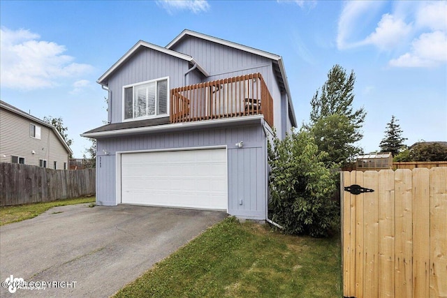 3709 Encore Cir, Anchorage, AK 99507 - traditional home with a balcony, an attached garage, and driveway