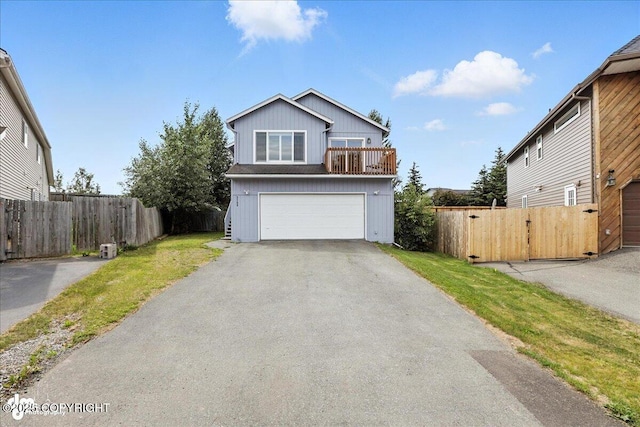 3709 Encore Cir, Anchorage, AK 99507 - traditional-style house with asphalt driveway, board and batten siding, an attached garage, and a balcony