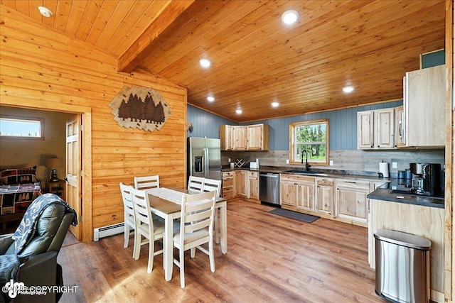 23634 Kasilof River Cir, Kasilof, AK 99610 - kitchen featuring stainless steel appliances, dark countertops, wood ceiling, light wood-style floors, and backsplash
