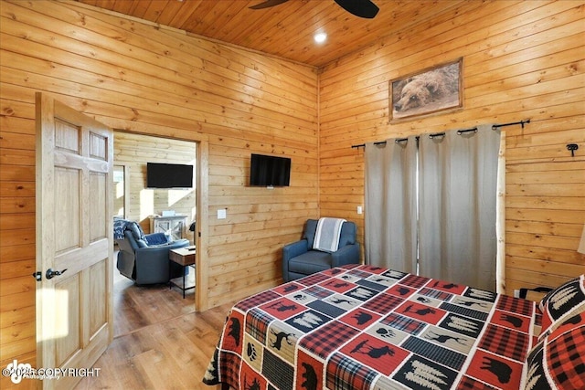 23634 Kasilof River Cir, Kasilof, AK 99610 - bedroom with wood ceiling, wood finished floors, wood walls, recessed lighting, and a ceiling fan